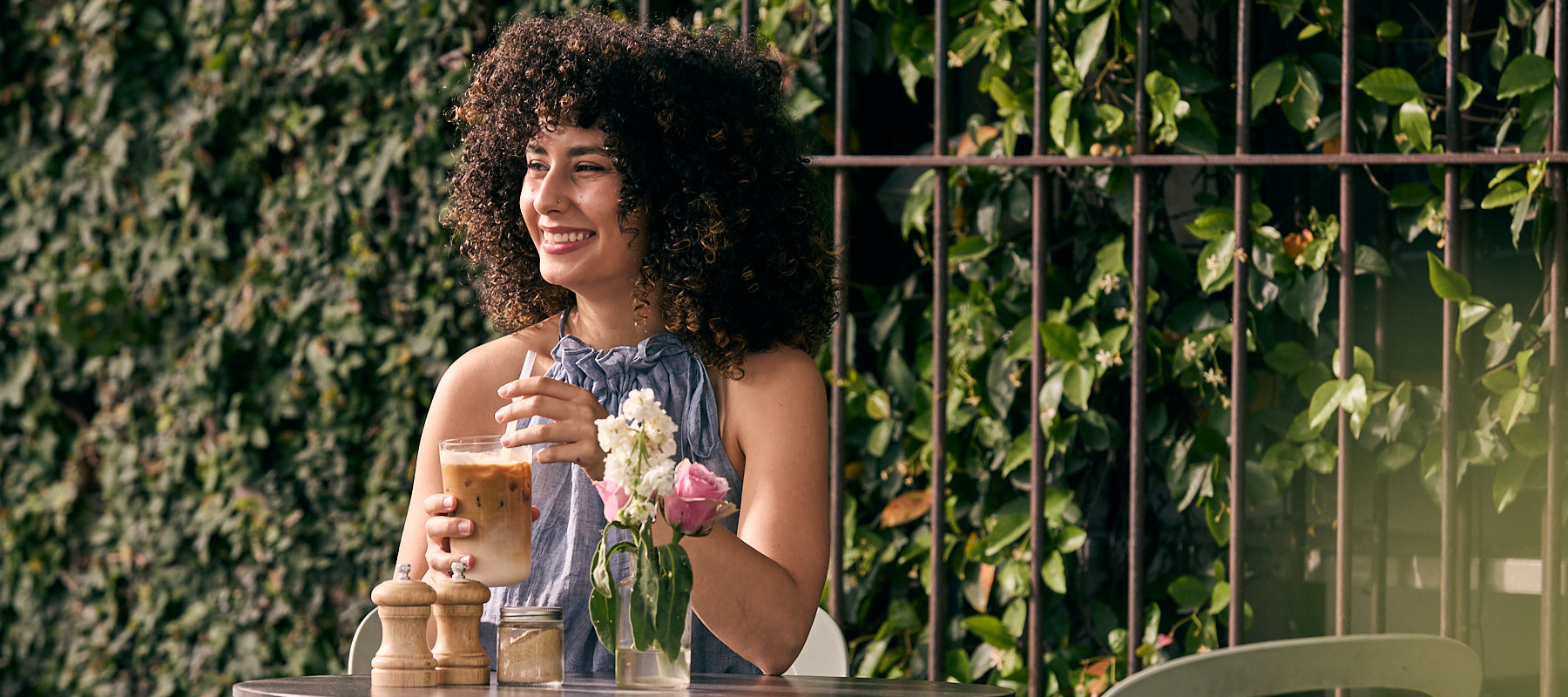 Woman drinking iced latte