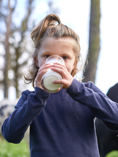 Farm children with milk