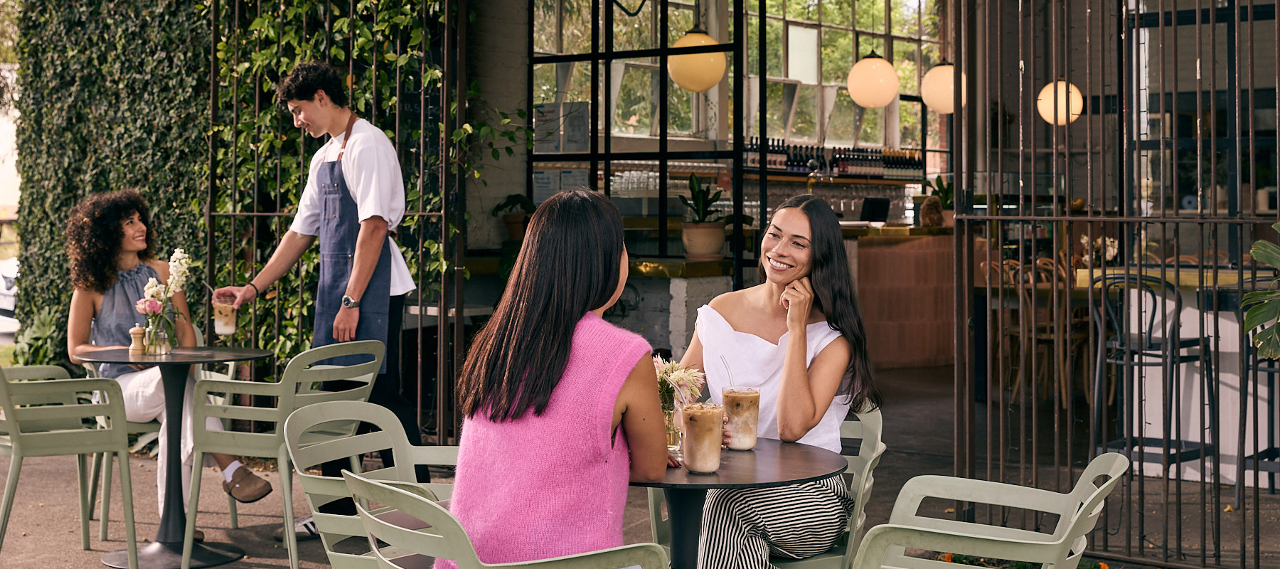 Women at a cafe drinking coffee