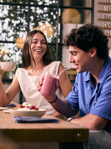 Young man and woman at restaurant 
