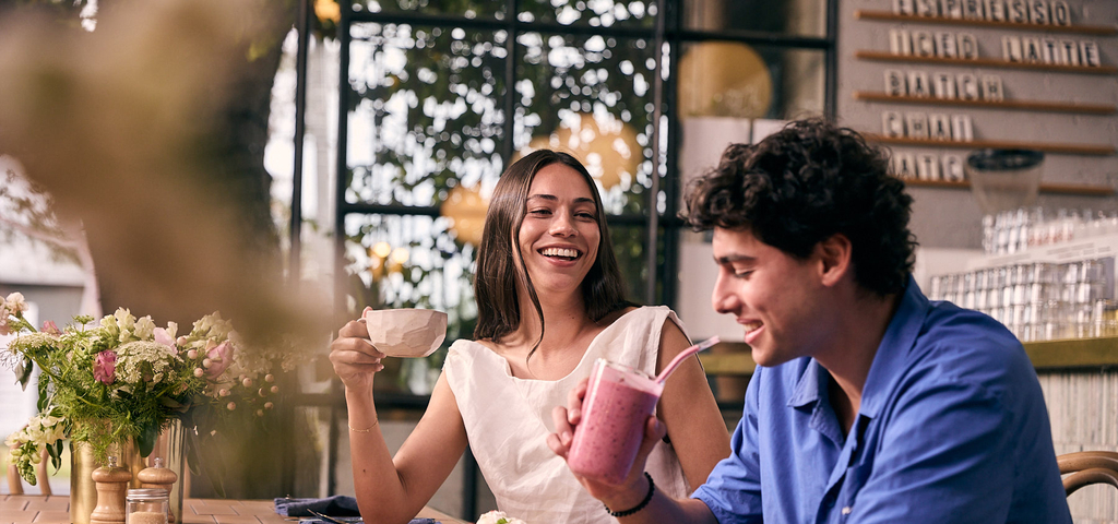 Young man and woman at restaurant 
